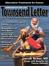 Magazine cover, with article titles and photo of man and dog in a canoe.