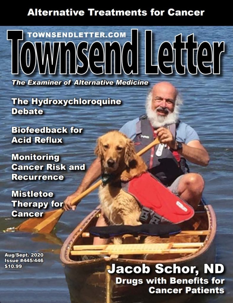 Magazine cover, with article titles and photo of man and dog in a canoe.